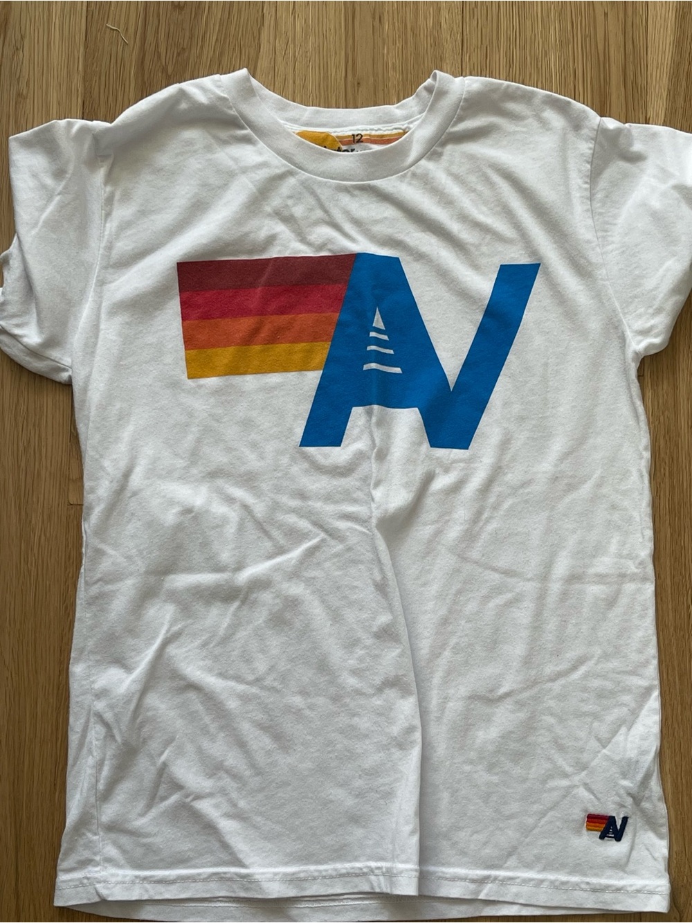 Aviator Nation White Short-Sleeve Tee with Blue 'A' and Red-Orange-Yellow Stripe